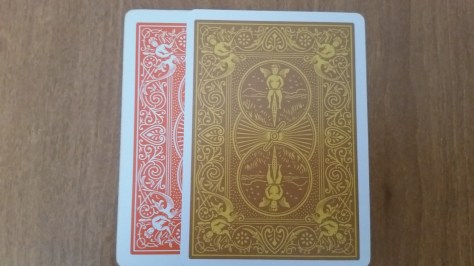 The border of the card is thinner than your standard bicycle back. Compared against Bicycle Orange.